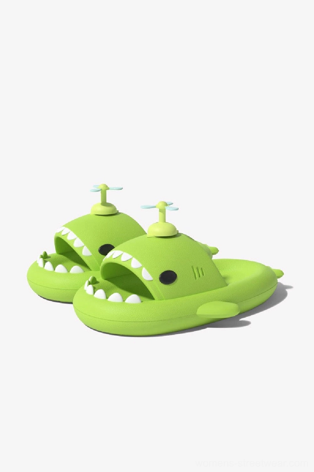 Pair of green propeller shark slide slippers with fin and tooth details