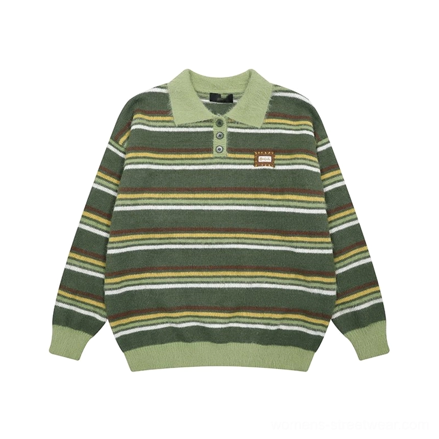 Flat lay of the green retro striped fuzzy knit polo sweater with yellow and gray horizontal stripes, green collar, ribbed trims, and chest badge
