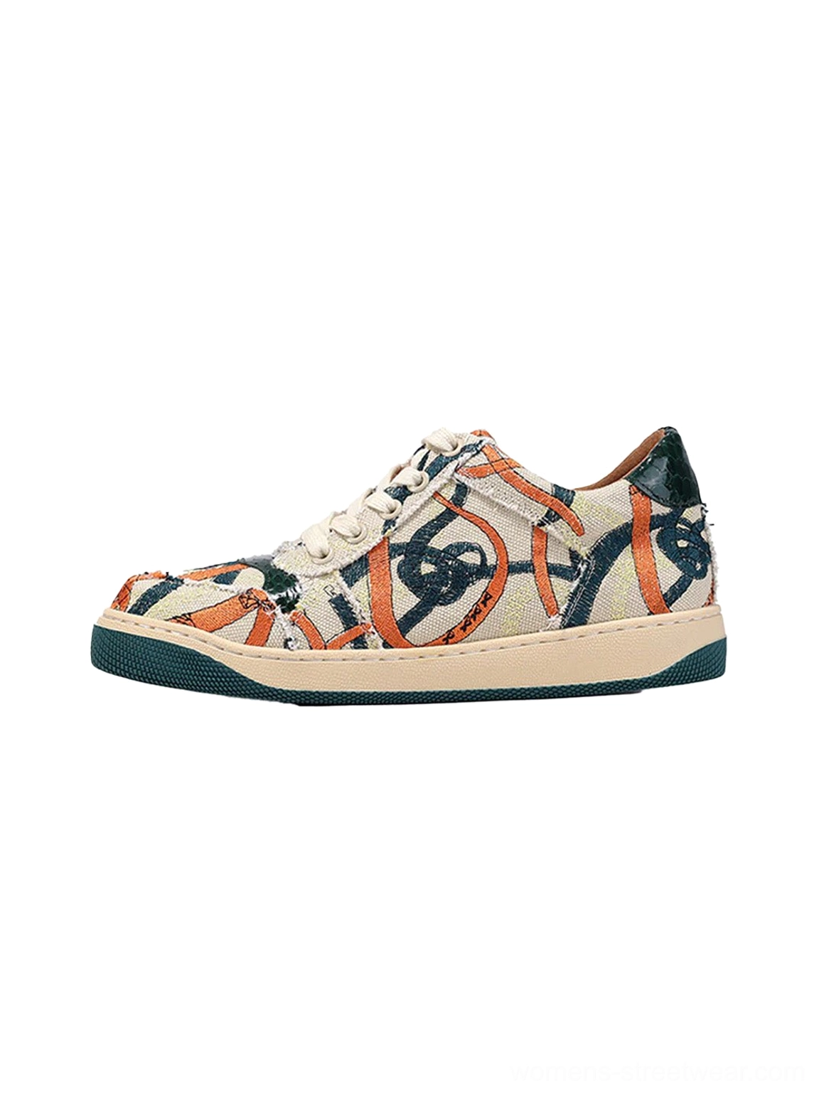 Green sole graffiti canvas low-top streetwear sneaker in right side three-quarter product view with orange and navy printed artwork