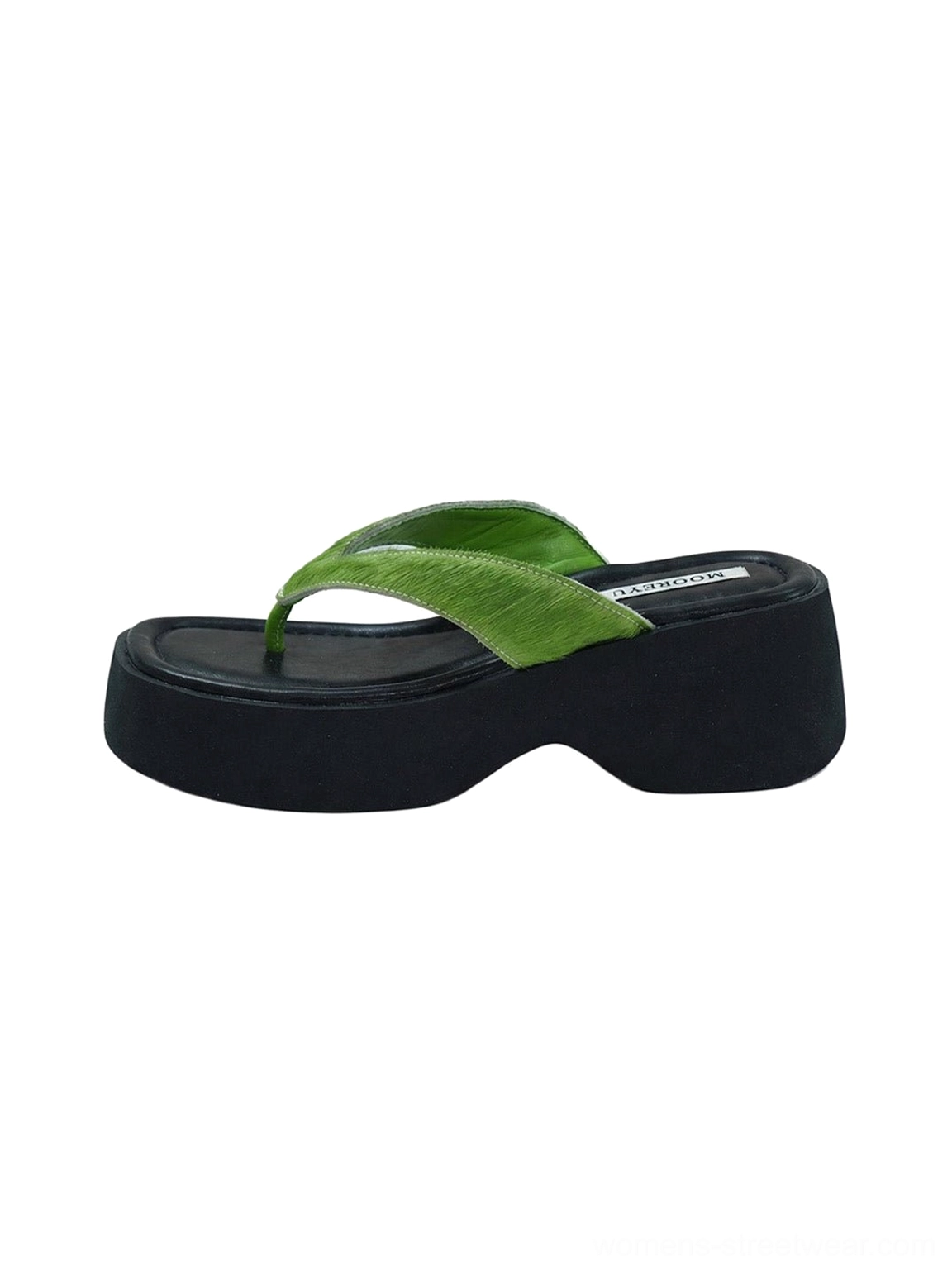 Black chunky platform flip-flops with green suede toe strap and branded footbed on white background
