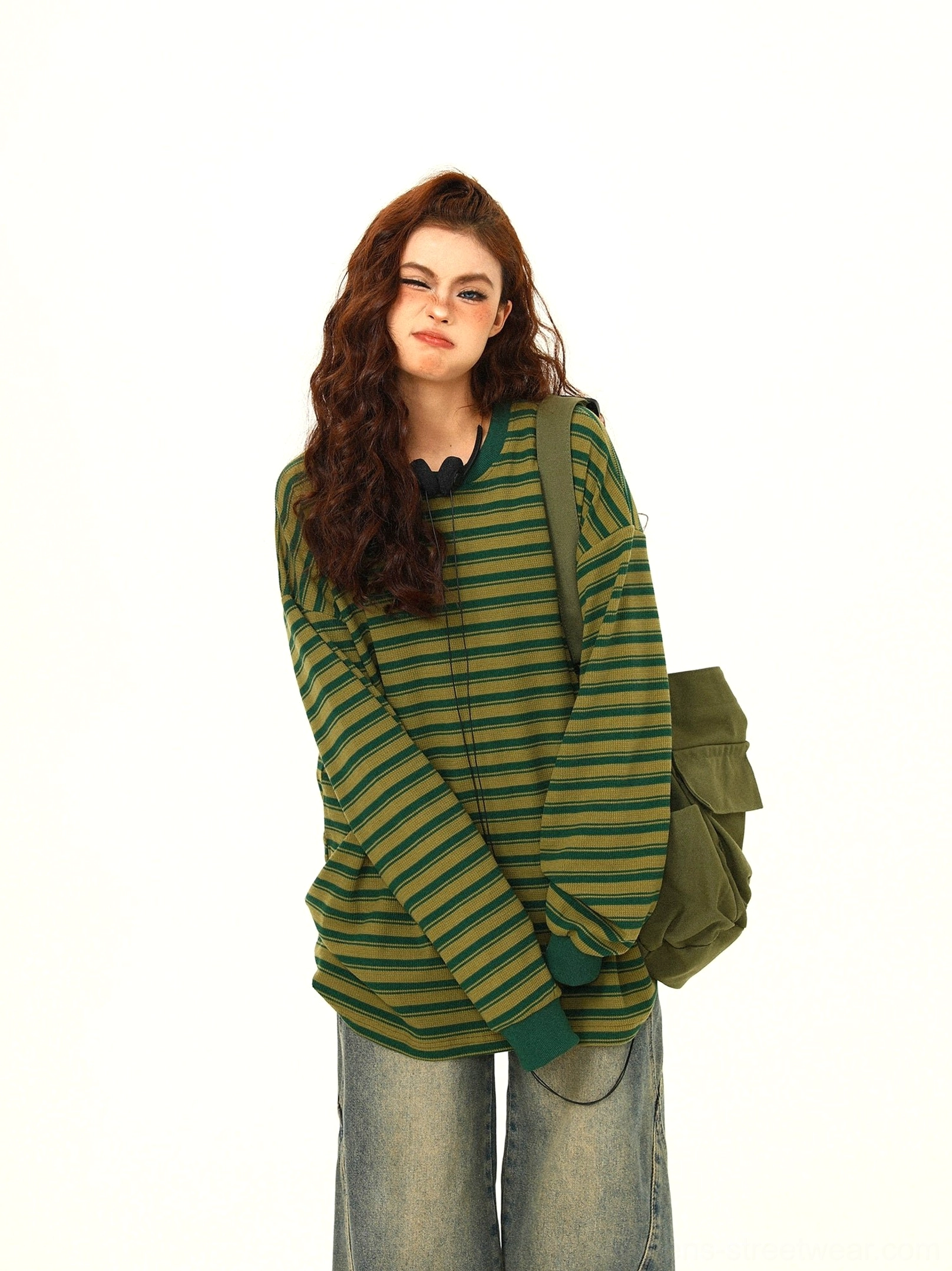 Green yellow striped oversized cotton long sleeve tee close up showing ribbed crew neck cuffs and relaxed fit