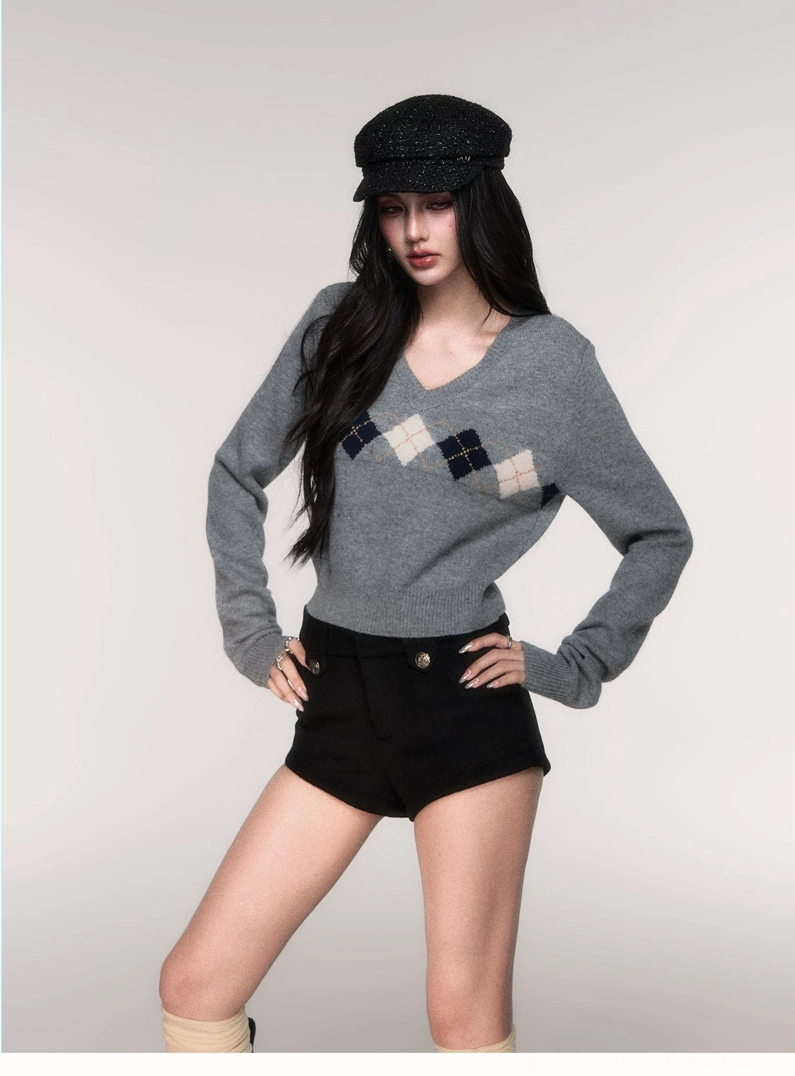 Side view of grey argyle cropped V-neck sweater for women showing waist-length fit and slim long sleeves