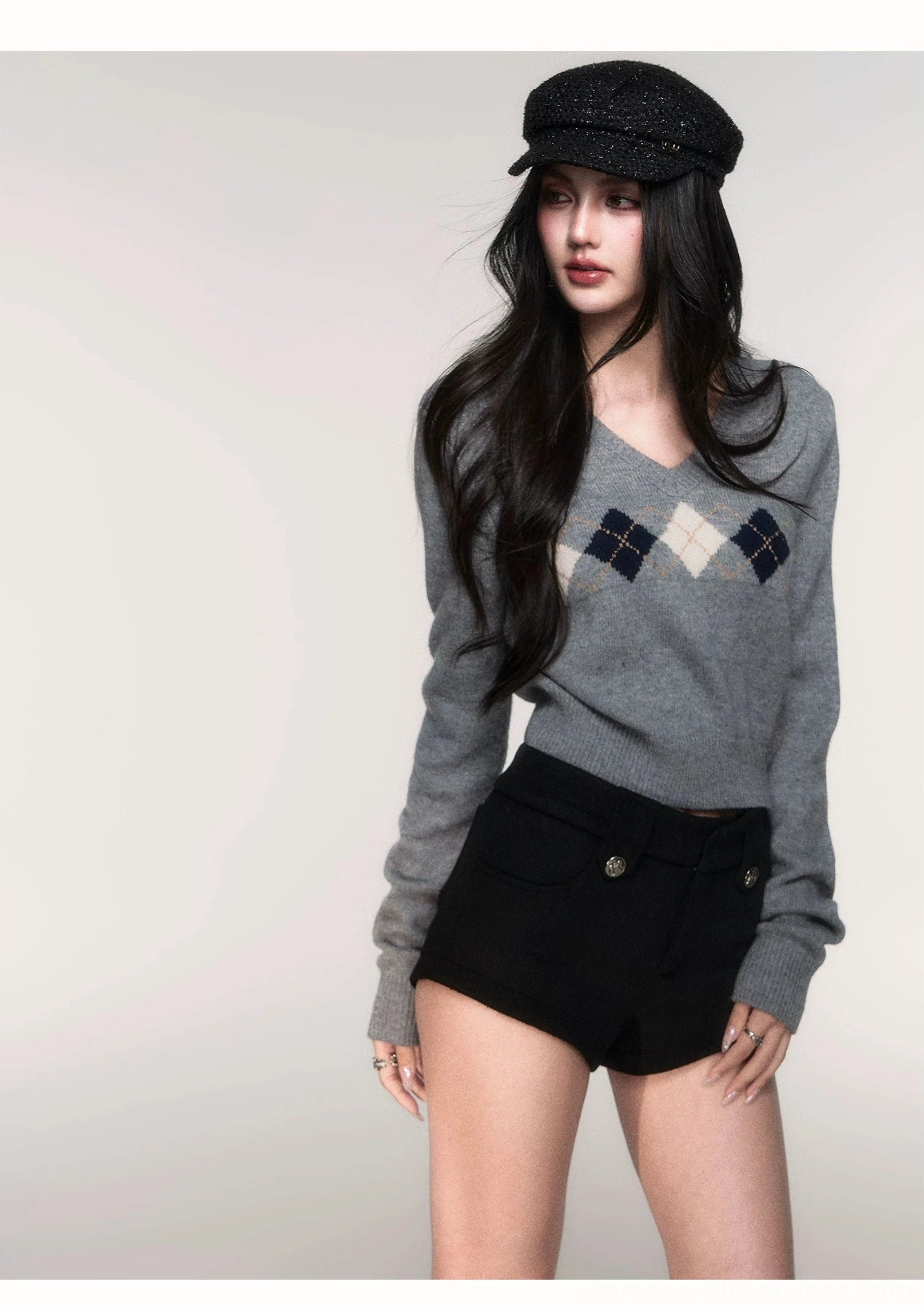 Full front studio view of women's grey cropped argyle sweater with classic V-neck and diamond chest motif