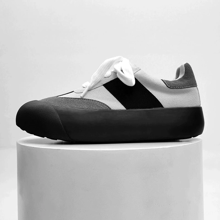 Grey and black vintage chunky sneakers featuring mixed suede panels subtle side stripe and thick black platform outsole