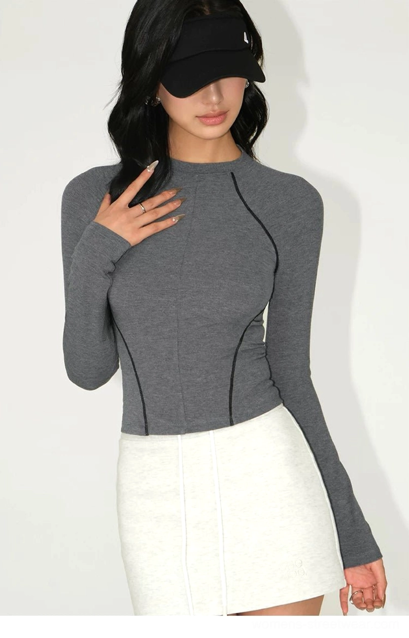 Grey contrast stitch cropped tee crew neck close-up white mini skirt delicate earrings refined detail