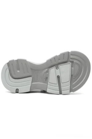 Bottom view of grey faux fur lined platform clog showing segmented anti-slip tread pattern and thick two-tone grey rubber platform sole
