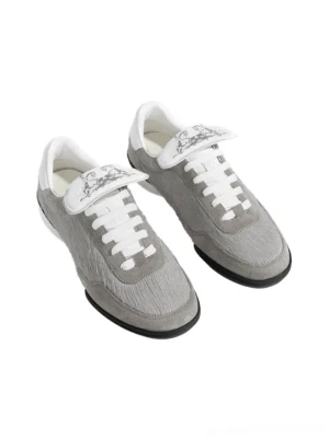 Pair of grey fuzzy fur-lined platform sneakers overhead front view with white laces and retro fold-over tongues