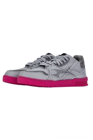 Grey and hot pink low top streetwear sneakers in side three-quarter view with lace-up panelled upper and pink outsole