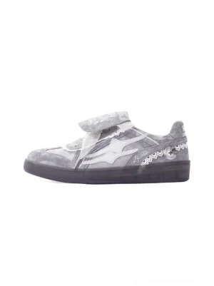 Grey lace-wrapped retro trainer sneaker side view with washed upper, graffiti flap and dark rubber sole