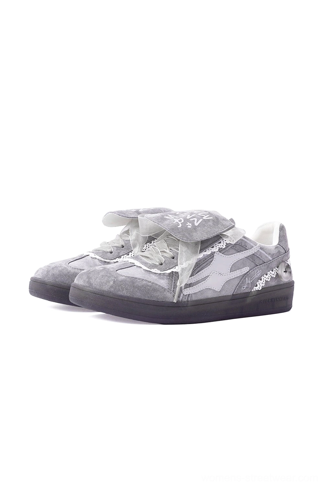 Front view pair of grey lace-wrapped retro trainer sneakers with graffiti flaps and dark outsoles