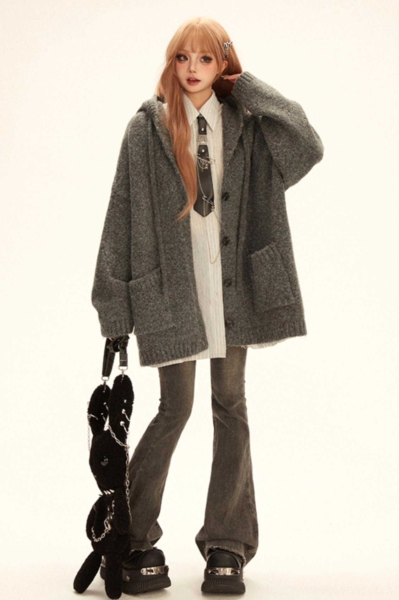Grey oversized hooded knit cardigan coat styled with striped shirt tie flared jeans and platform shoes in Korean streetwear outfit