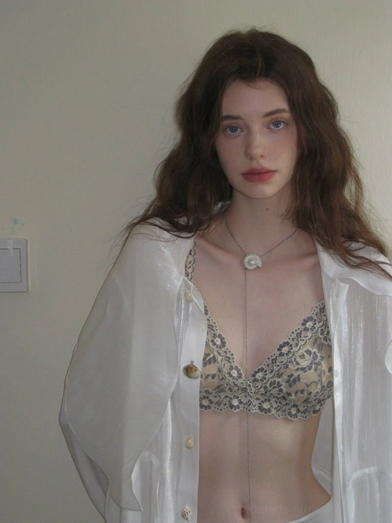 Vintage floral lace bralette layered under a button up sheer white chiffon shirt with pearl necklace