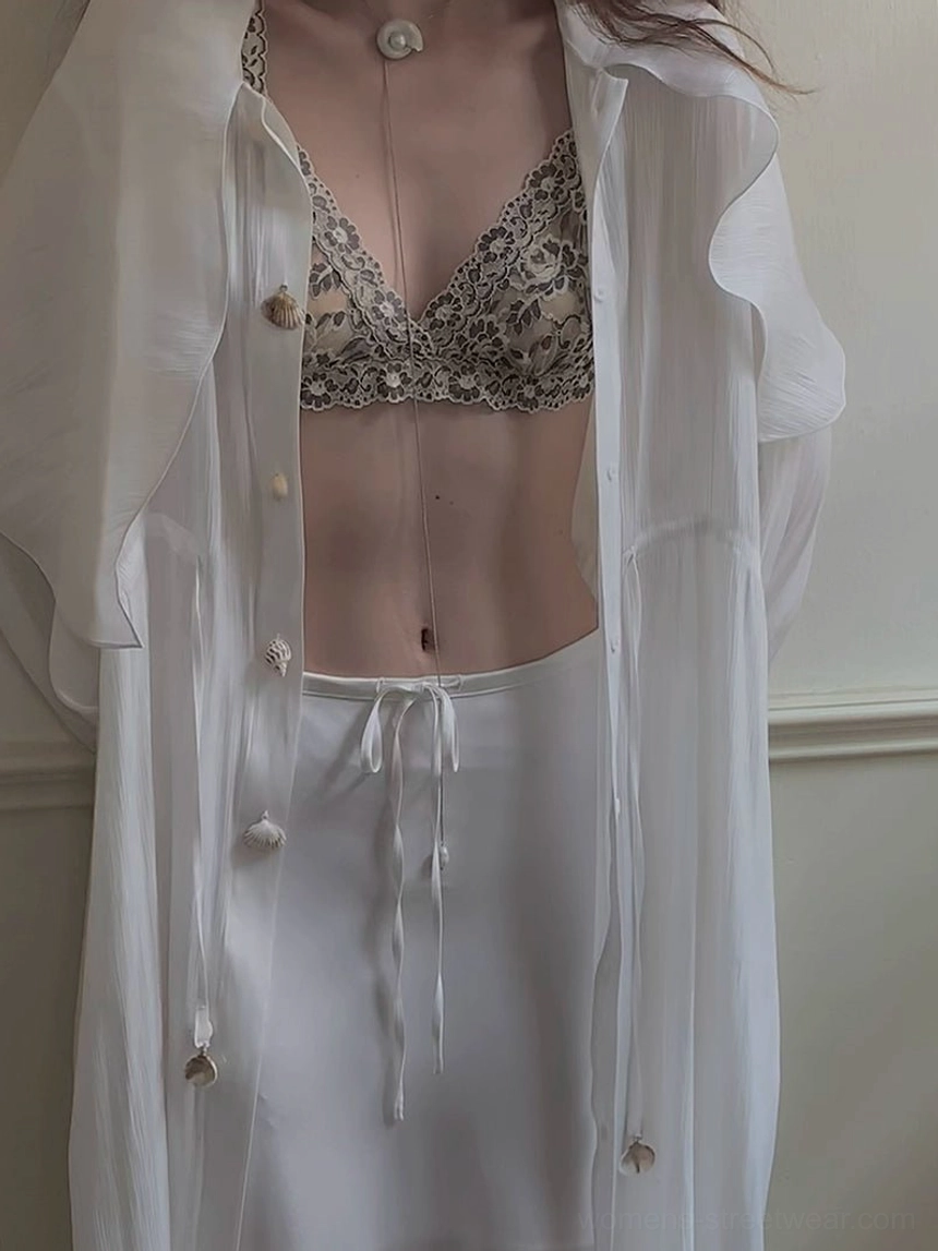 Vintage floral lace bralette styling with a sheer chiffon shirt satin skirt and pearl pendant necklace