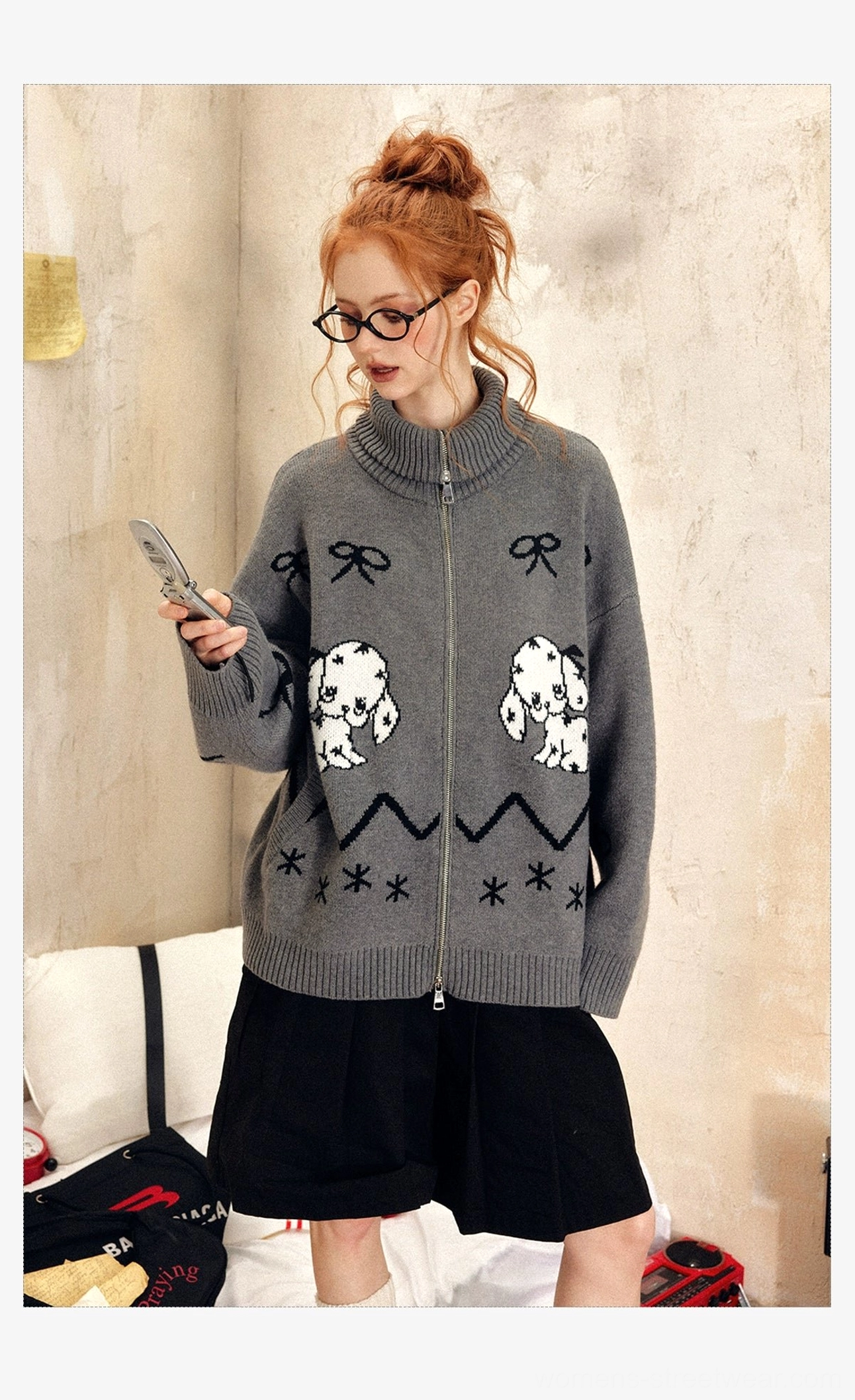 Side view of a relaxed grey oversized puppy print zip-up sweater with bow and retro motifs styled for casual Seoul fashion