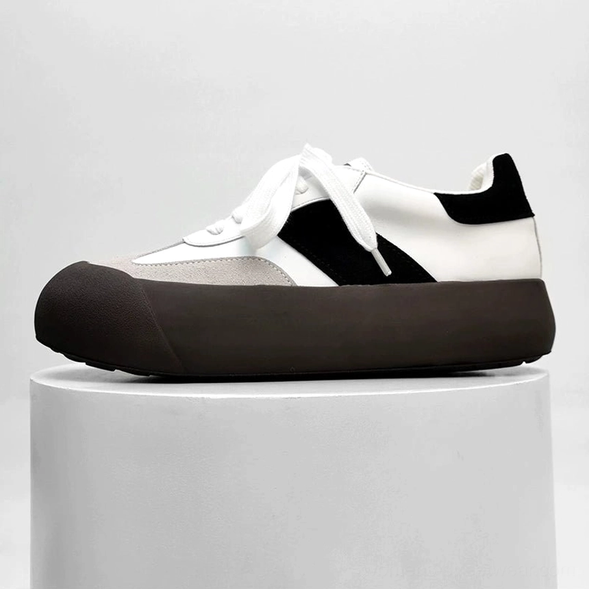 Grey and white vintage chunky sneakers with black side stripe suede toe cap and dark brown rubber outsole