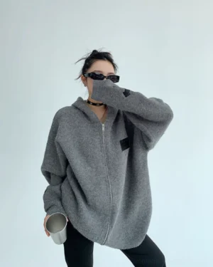 Heather gray oversized cross patch zip-up knit hoodie jacket left side view with dropped shoulders