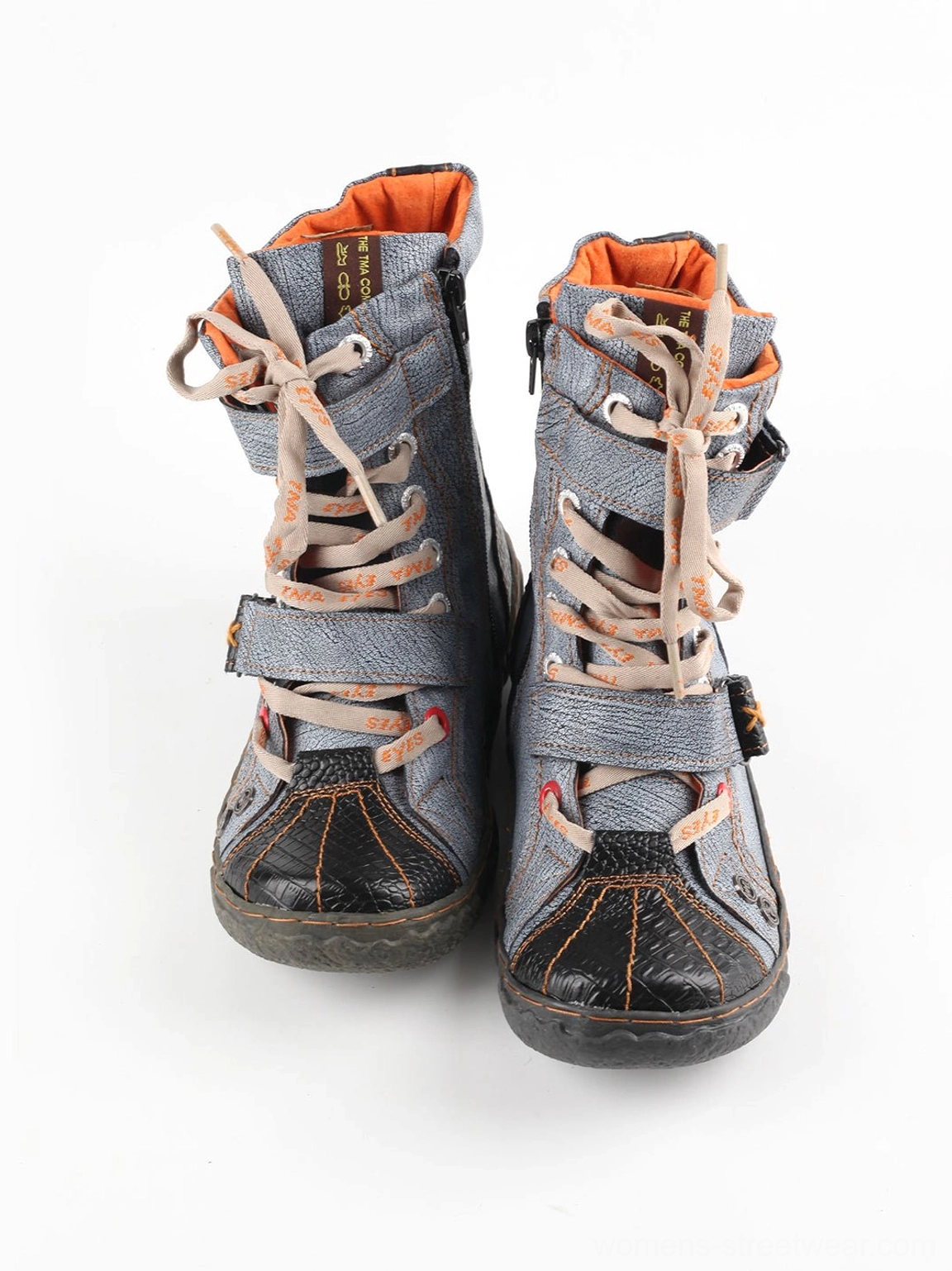 Front view of black and gray hand-stitched mid-calf streetwear boots with lace-up closure and orange lining