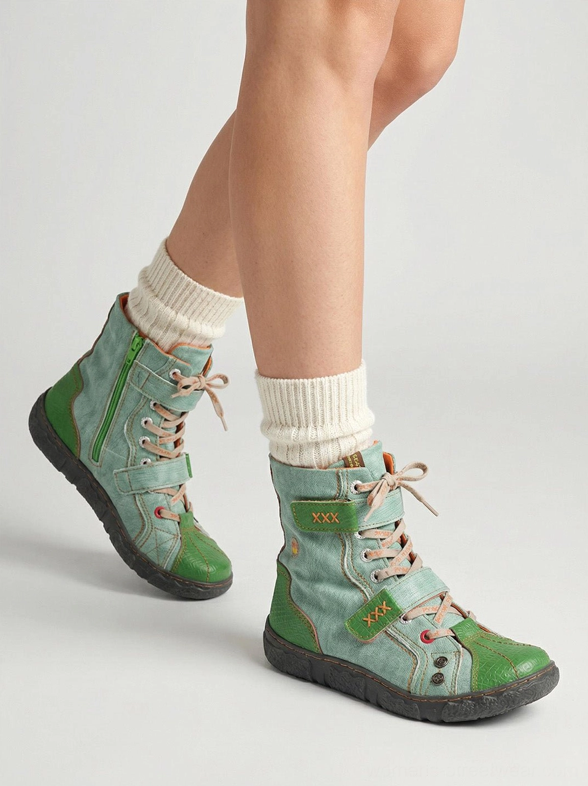 Hand-stitched mid-calf streetwear boots with visible panel stitching, lace-up closure and flexible anti-slip sole