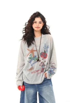 Heather gray doodle graffiti oversized long sleeve streetwear tee front full body view with wide leg denim