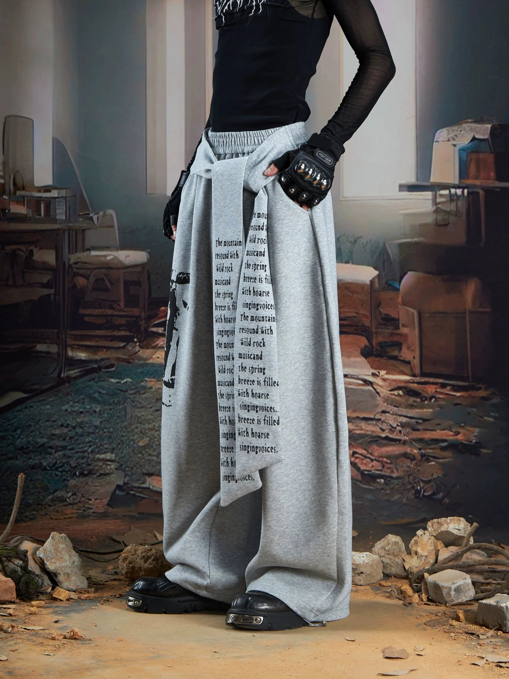 Heather gray draped panel graphic wide-leg streetwear joggers with text print waist panel side front view
