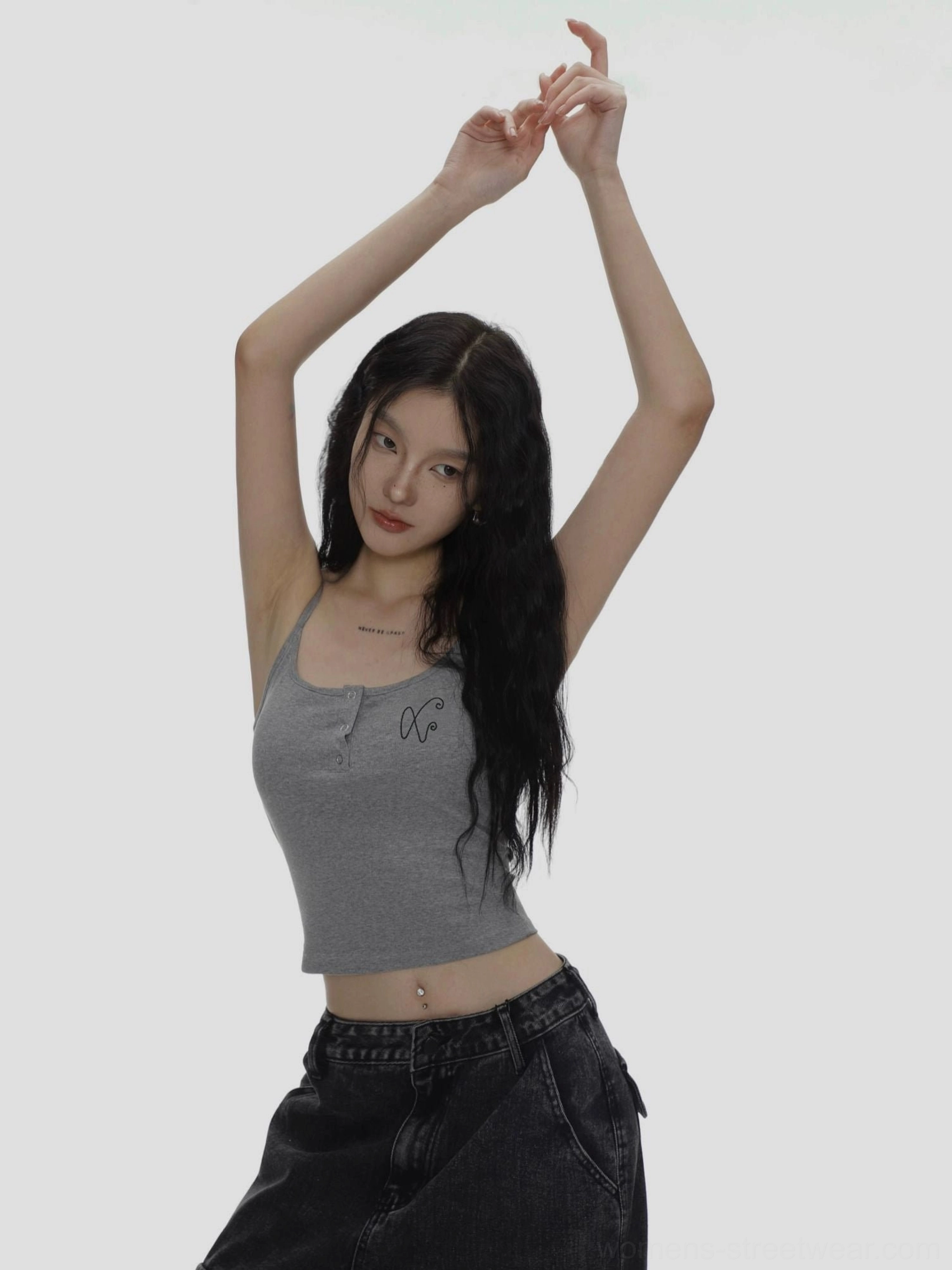 Heather gray fitted ribbed camisole with spaghetti straps and XO chest embroidery styled with low rise black jeans