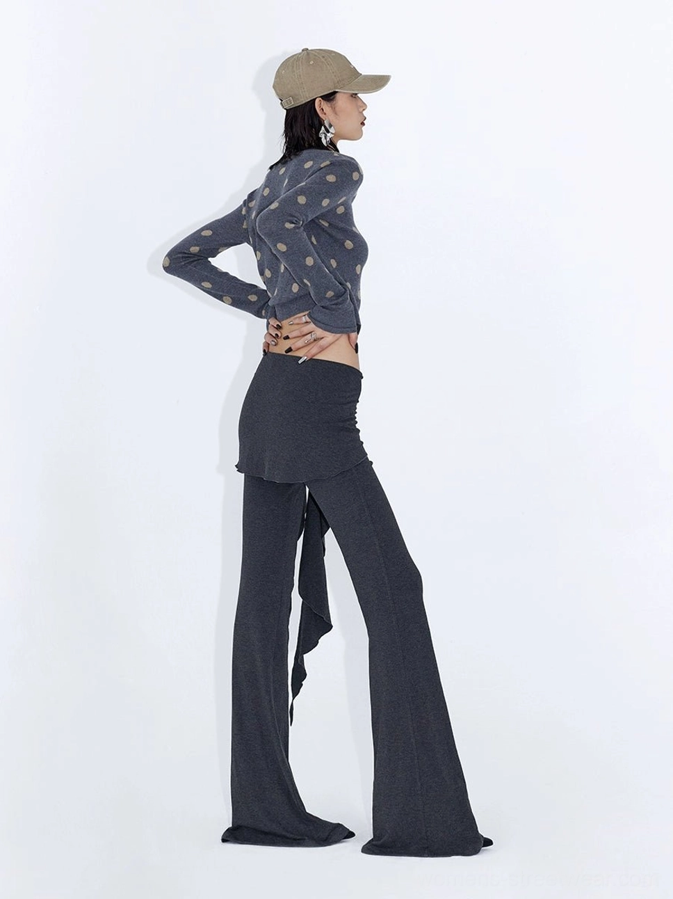 Heather gray low rise wrap drape flare streetwear pants shown from the side with a hanging asymmetric waist tie and slim flared leg