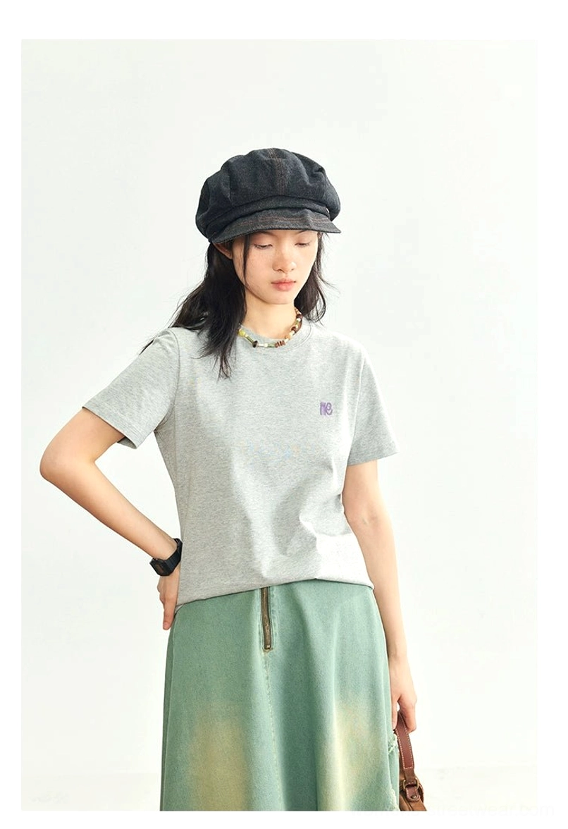 Heather gray minimalist embroidered logo crew neck t-shirt flat lay minimalist styling streetwear
