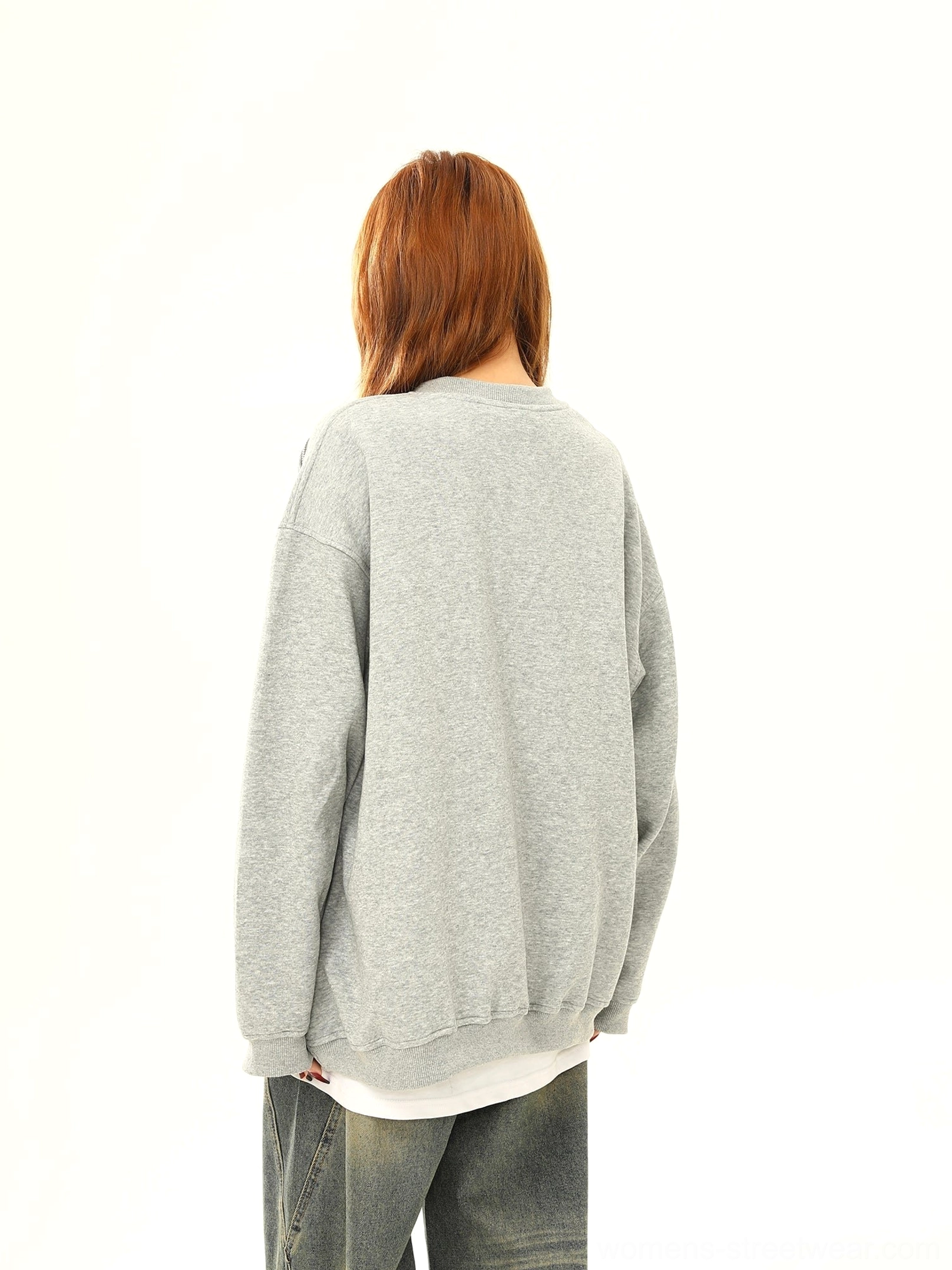 Back view of heather gray oversized crewneck sweatshirt with ribbed hem and drop shoulder silhouette