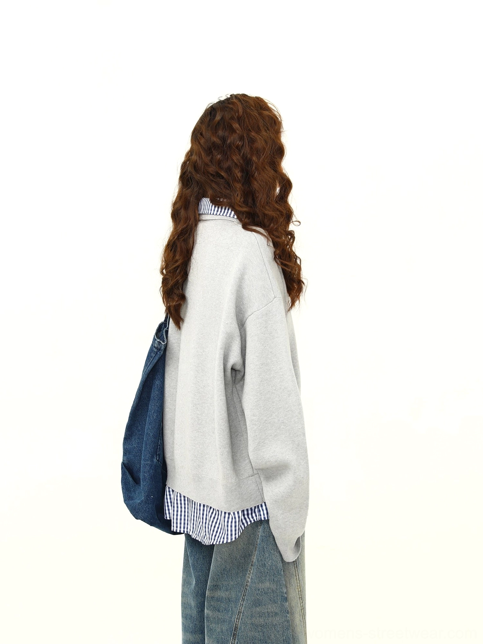 Back view of a heather gray oversized polo collar sweater styled with wide-leg jeans and a denim tote bag