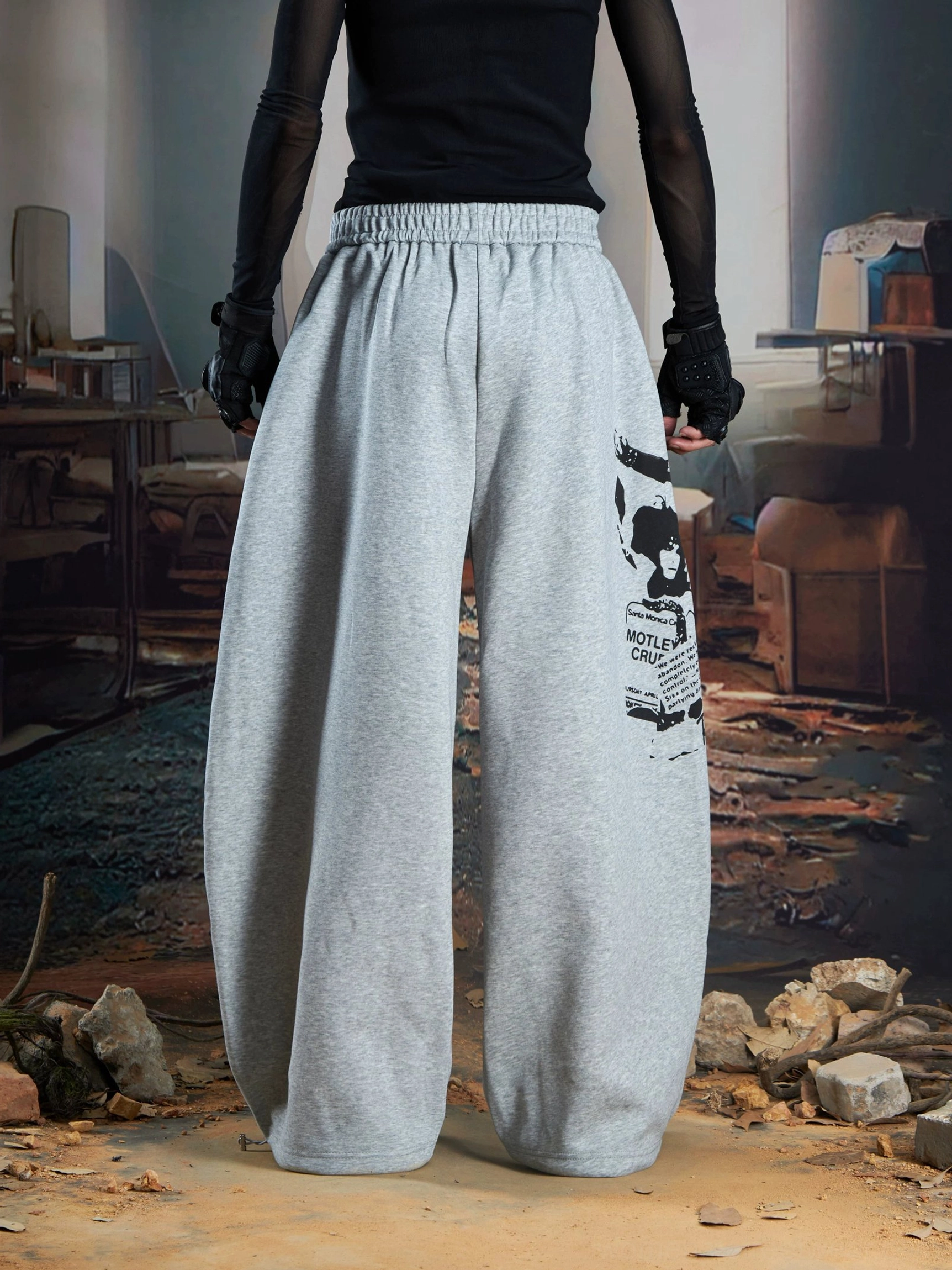 Heather gray oversized wide-leg graphic joggers with elastic waist and minimal leg print front view