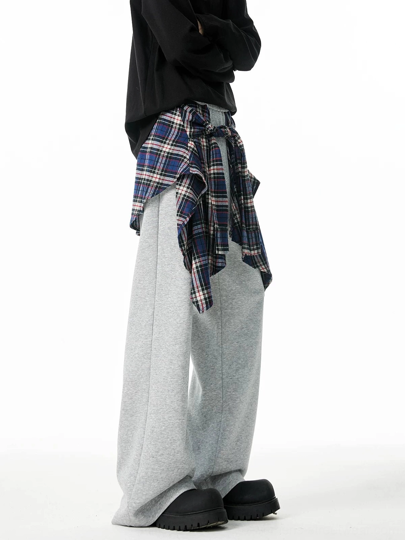 Heather gray layered plaid flannel wrap wide-leg jogger pants shown from a left rear three-quarter view with relaxed streetwear styling