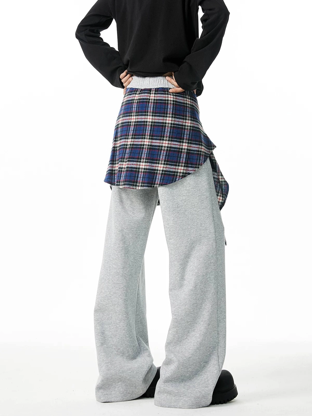Heather gray plaid layered wide-leg jogger pants shown from the rear with elastic waistband and sewn flannel wrap detail