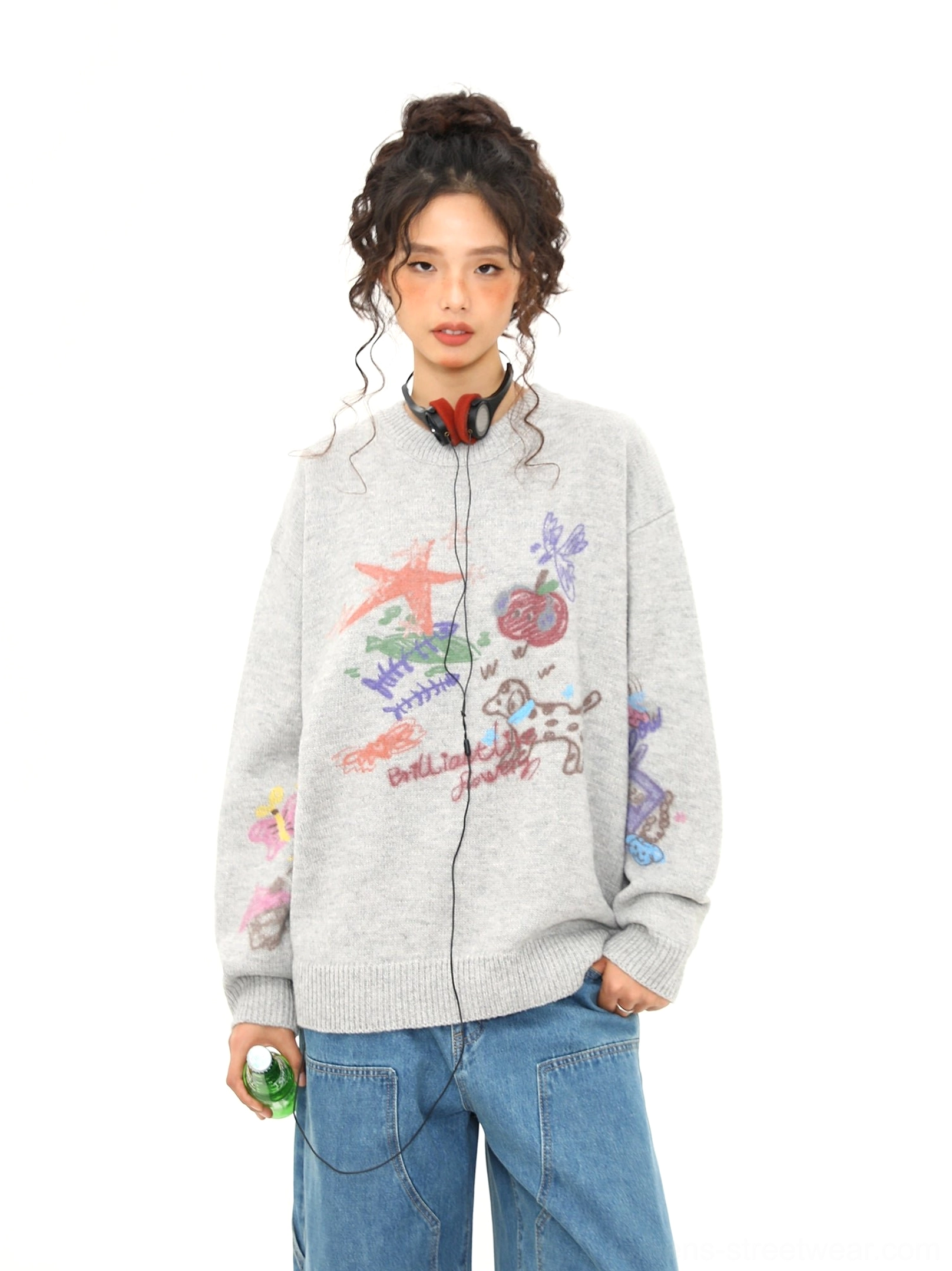 Flat lay front detail of heather gray oversized crewneck knit sweater with colorful puppy doodle and cartoon print artwork