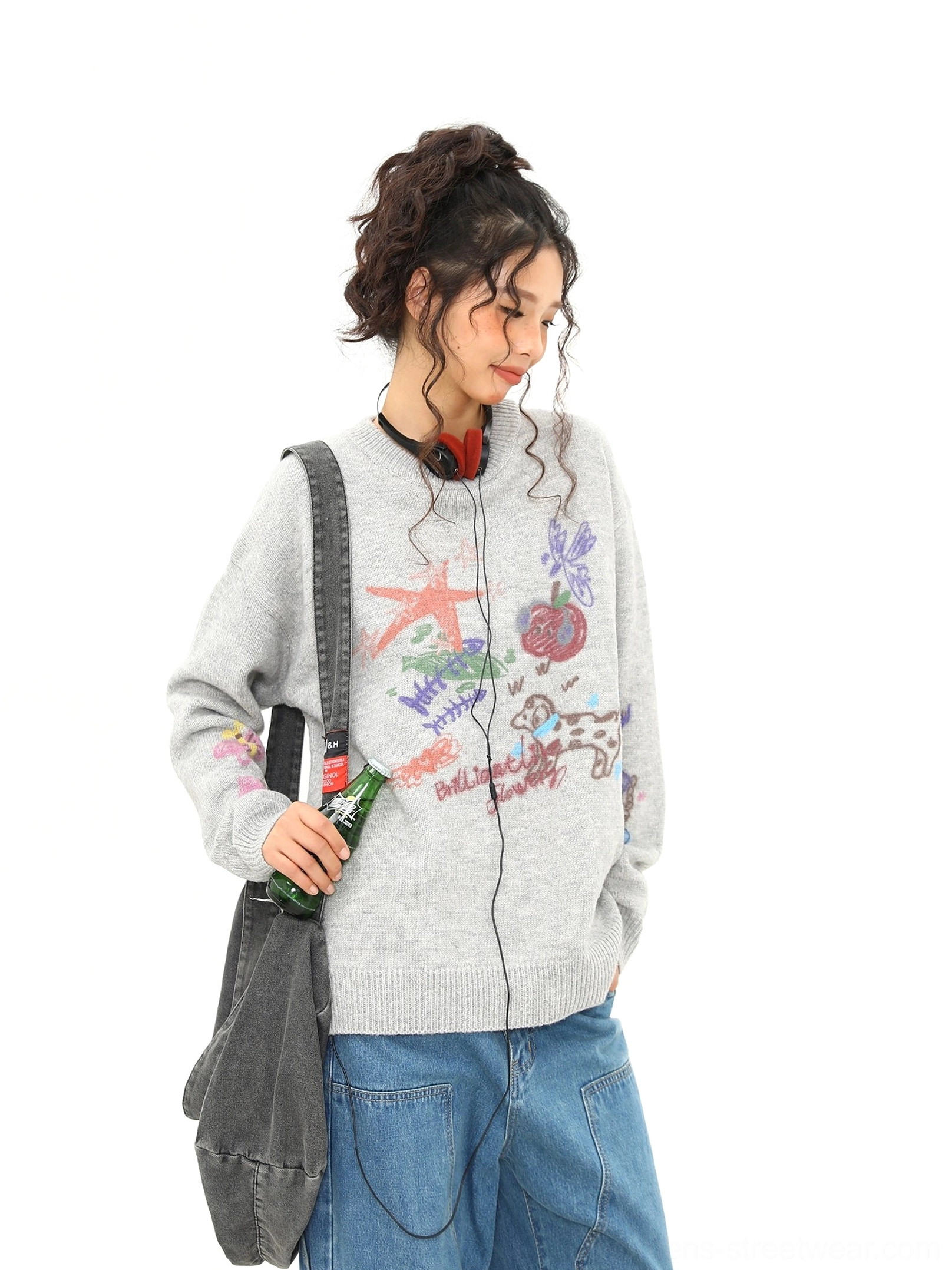 Side profile of heather gray oversized graphic knit sweater with cute puppy and starfish doodle details