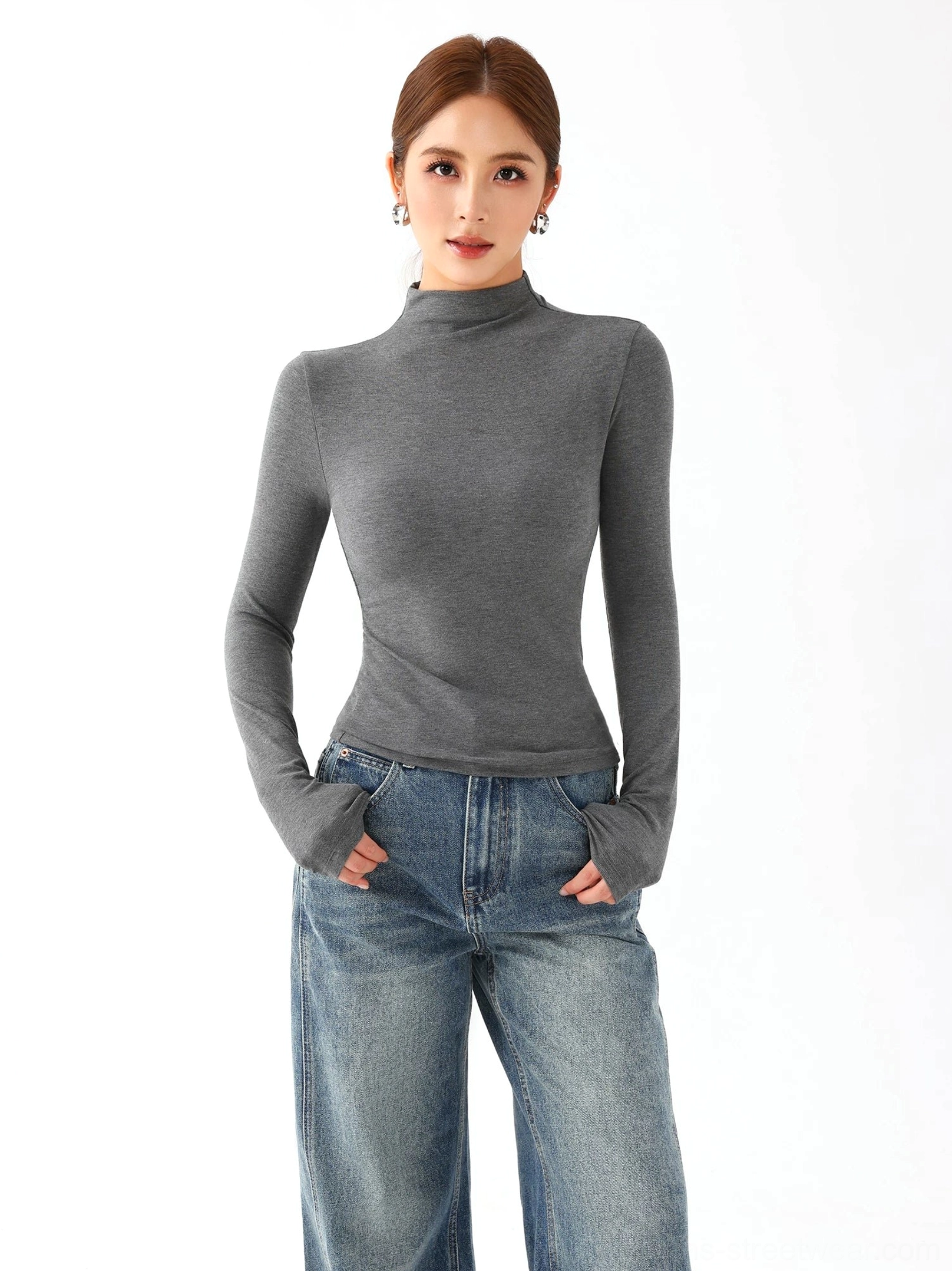 Heather gray women's slim fit mock neck knit top with long sleeves styled with relaxed blue jeans