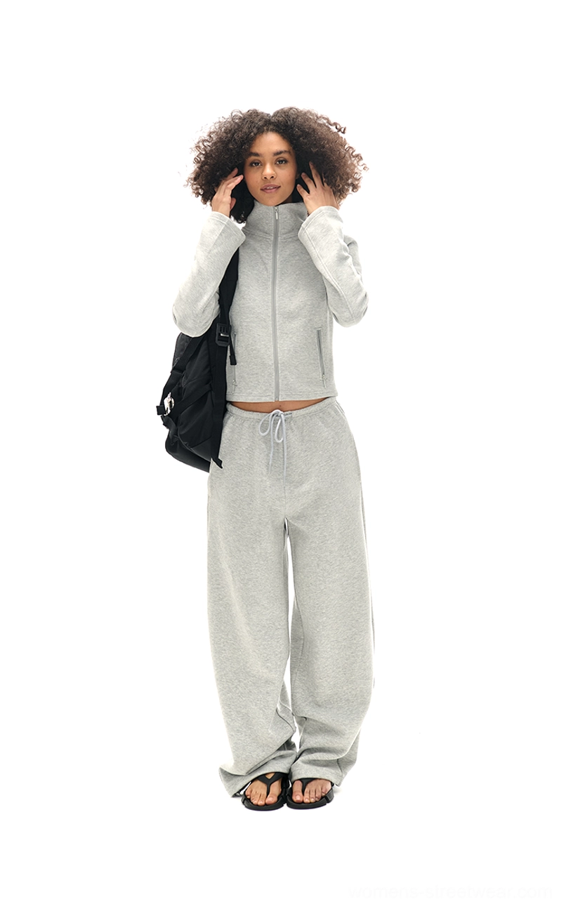 Back view of heather grey cropped high collar sweatshirt and high-waisted loose sweatpants streetwear outfit