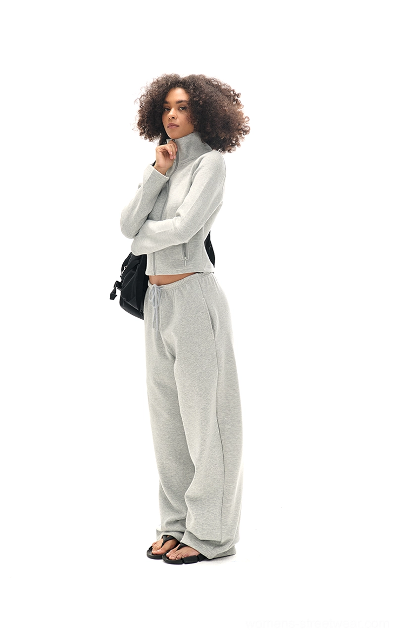 Side profile of heather grey cropped zip-up sweatshirt and relaxed wide-leg sweatpants matching set