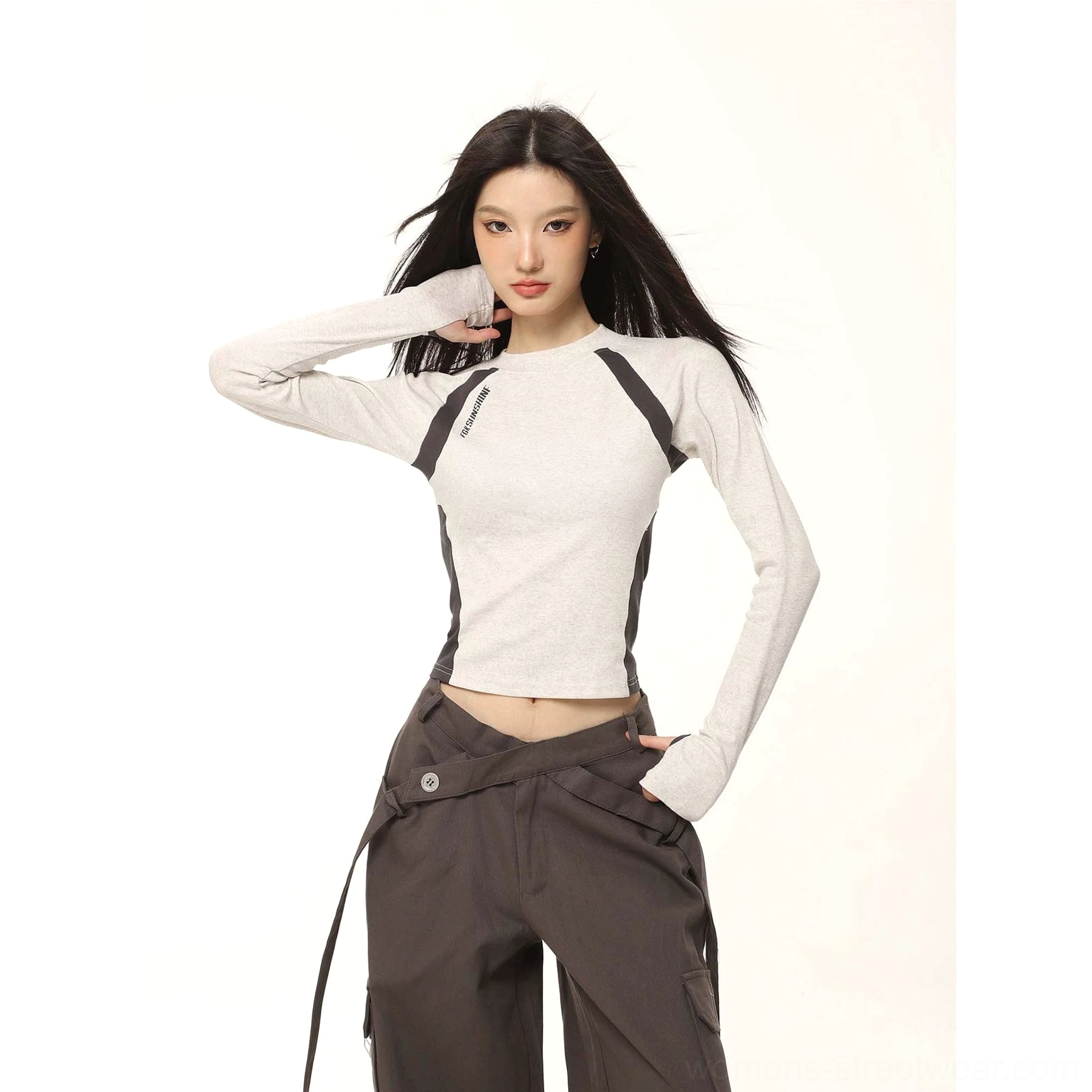 Heather grey fitted cropped long sleeve raglan top with black and white contrast panels paired with charcoal cargo pants