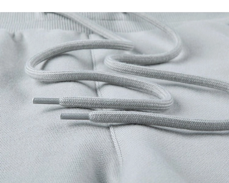 Relaxed raw hem drawstring sweat shorts elastic waist streetwear detail