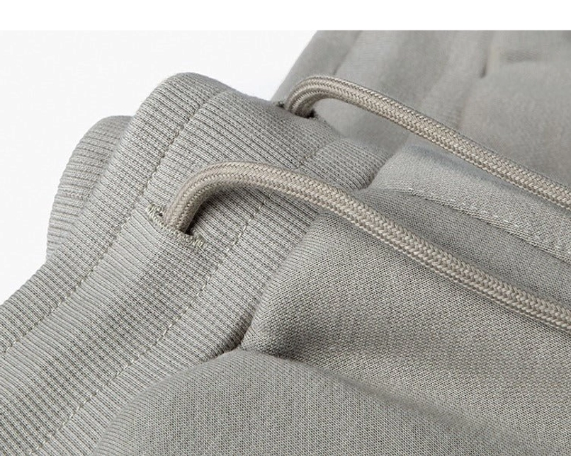 Heavyweight sweat shorts elastic ribbed waistband and drawstring threading detail close-up