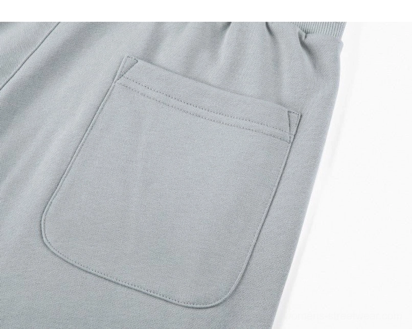 Raw hem drawstring sweat shorts side pocket and relaxed silhouette detail