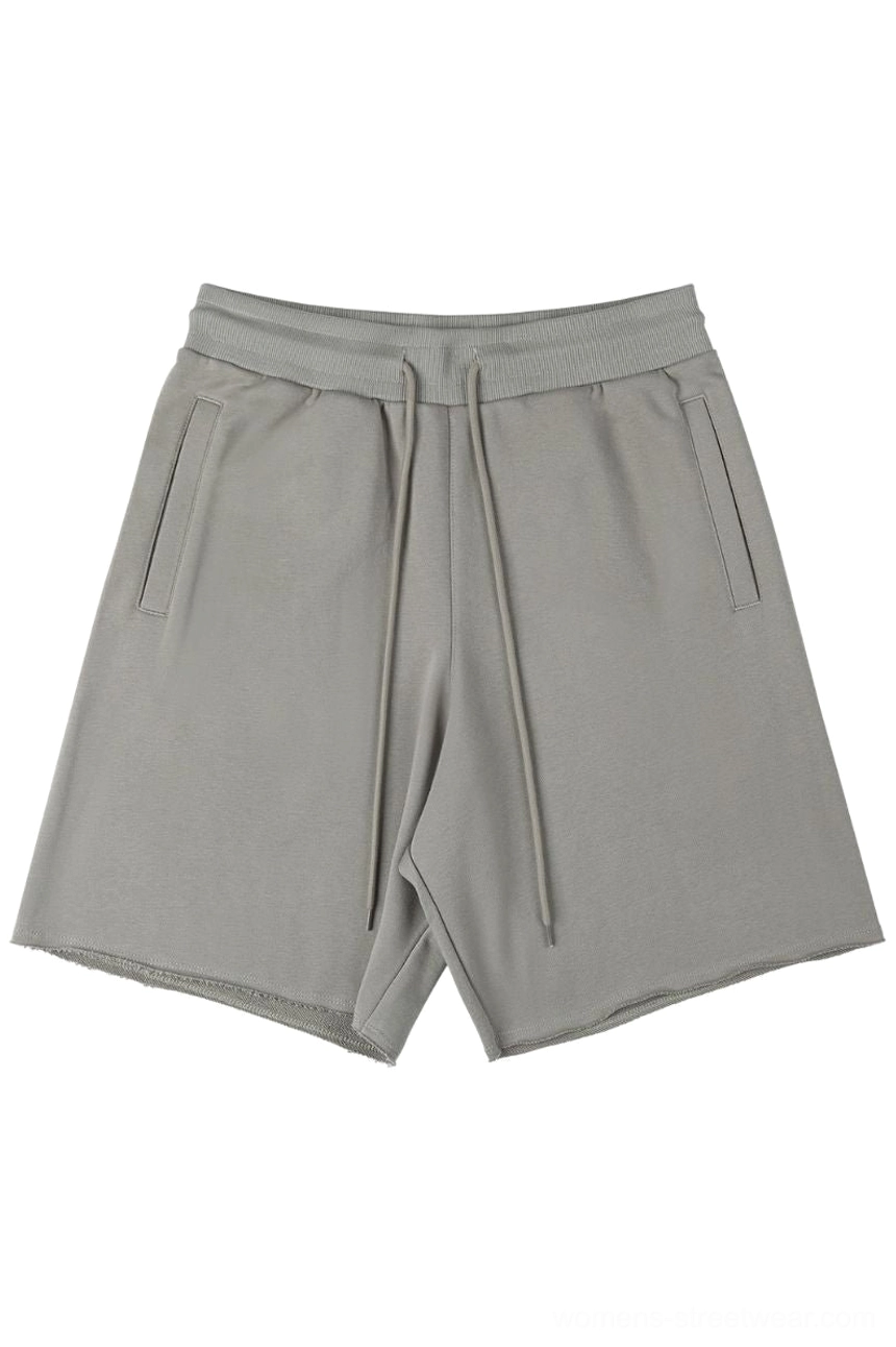 Taupe gray heavyweight raw hem drawstring sweat shorts front flat lay with elastic waist and side pockets