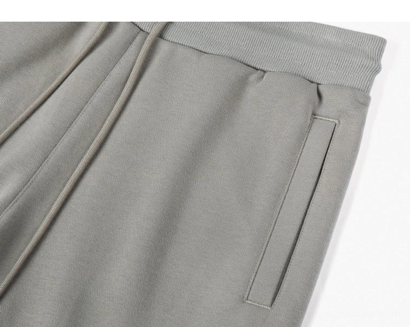 Taupe gray drawstring sweat shorts side pocket close-up showing soft heavyweight cotton blend texture