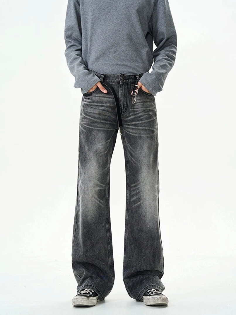 High-rise charcoal black washed jeans with zipper closure styled with a grey sweatshirt and casual sneakers