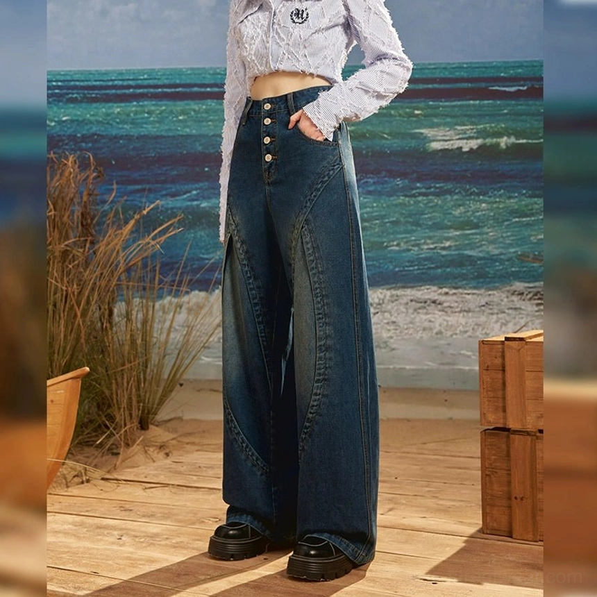 Back side view of high rise dark wash retro wide leg jeans featuring curved seams, four-button fly and vintage denim finish