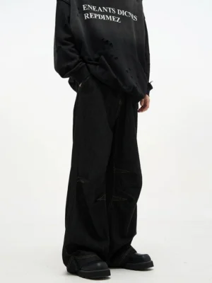 Front full body streetwear look featuring black baggy denim jeans with a relaxed ultra wide leg fit and heavy denim texture