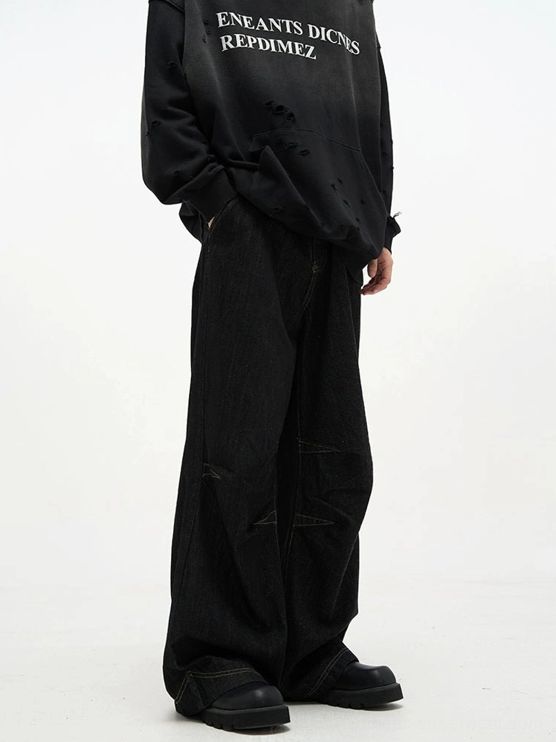 Front full body streetwear look featuring black baggy denim jeans with a relaxed ultra wide leg fit and heavy denim texture