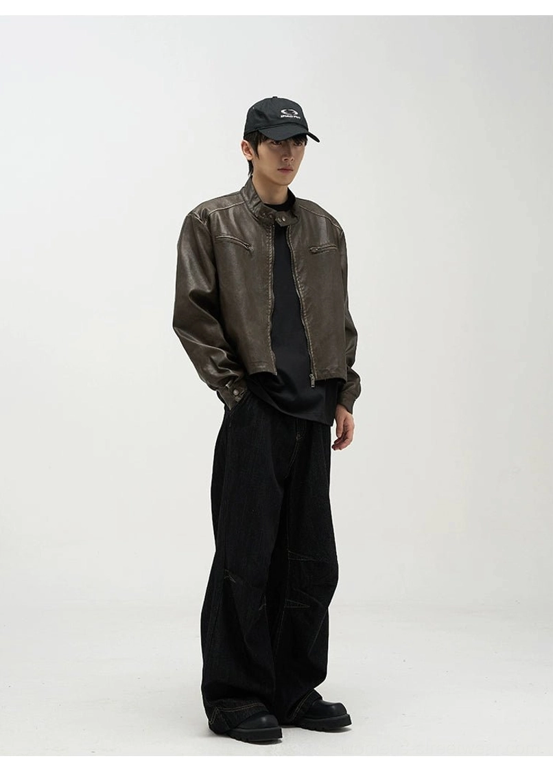 Side profile of oversized black baggy jeans with wide legs styled in a modern Korean streetwear outfit