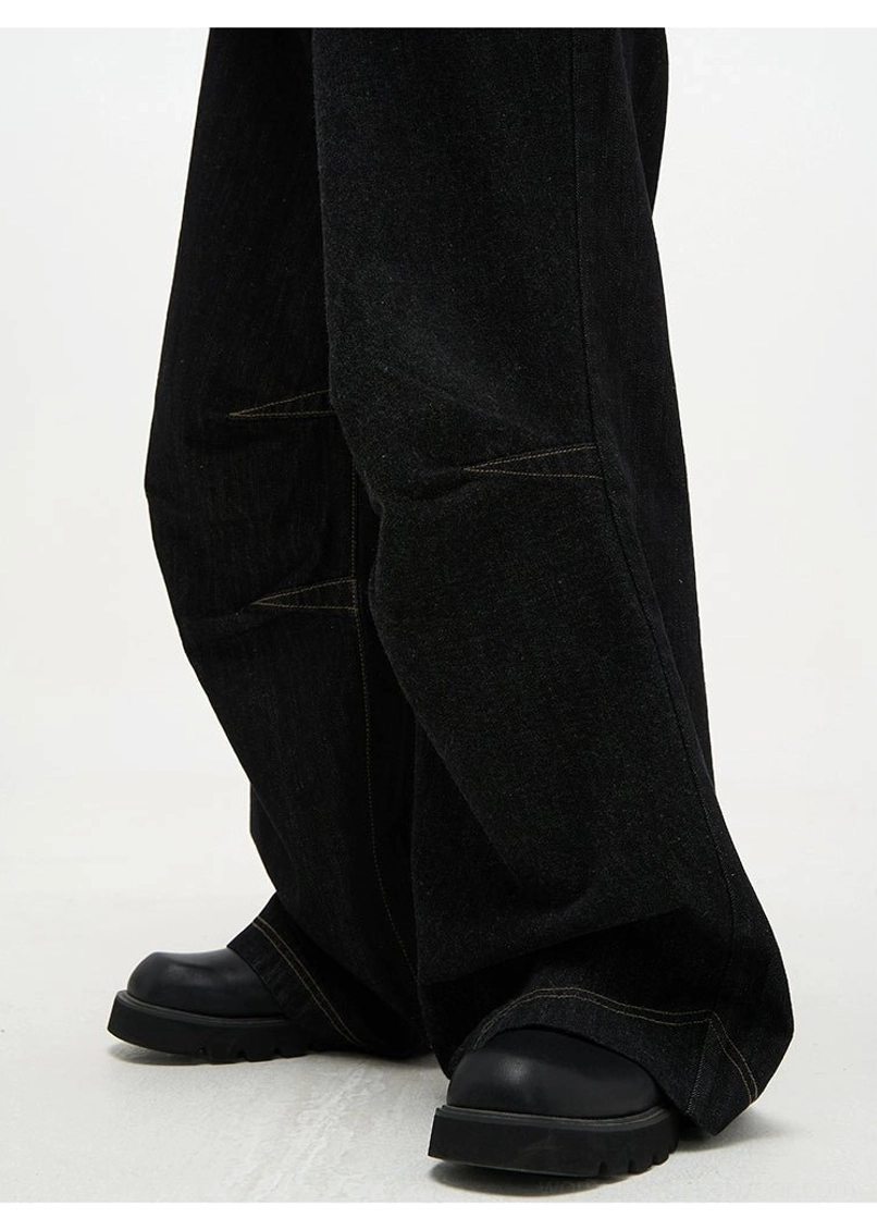 High waist black baggy denim jeans with contrast panel seams premium dark denim streetwear detail view