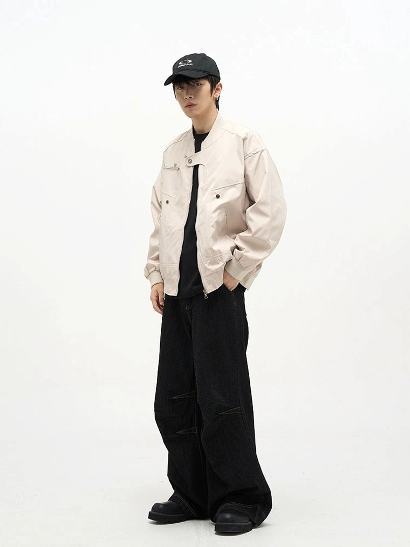 Side view of black high waist baggy denim jeans showing the loose wide leg silhouette and contrast panel seam construction